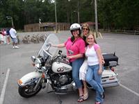 Participants enjoy Officer Reid's motorcycle.